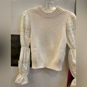 & Other Stories cream knit combo top with floral embroidered sleeves.